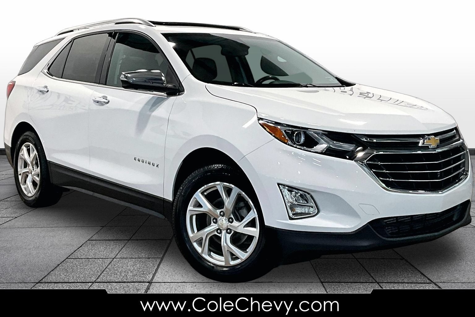 2021 Chevrolet Equinox Premier in Summit White — front three-quarter view